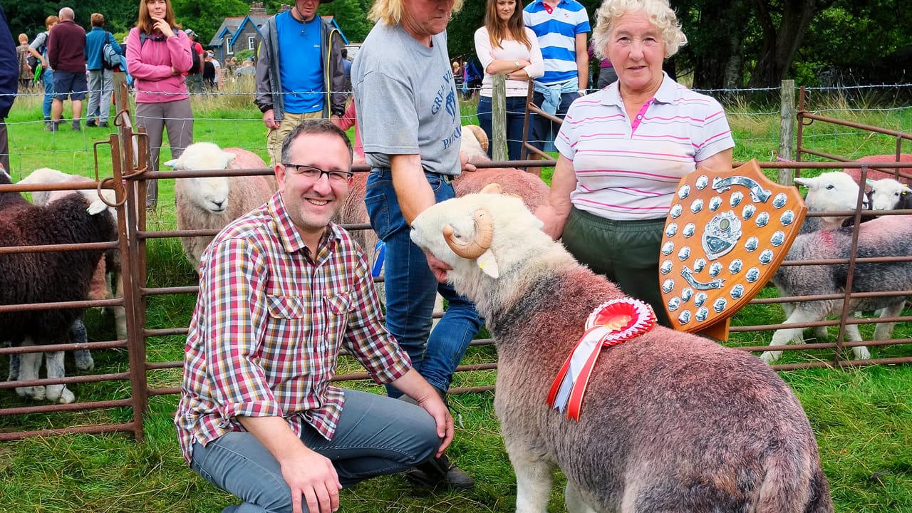 Spencer Hannah with a winning Herdwick sheep at a the Herdwick Sheep championship in the Lake District