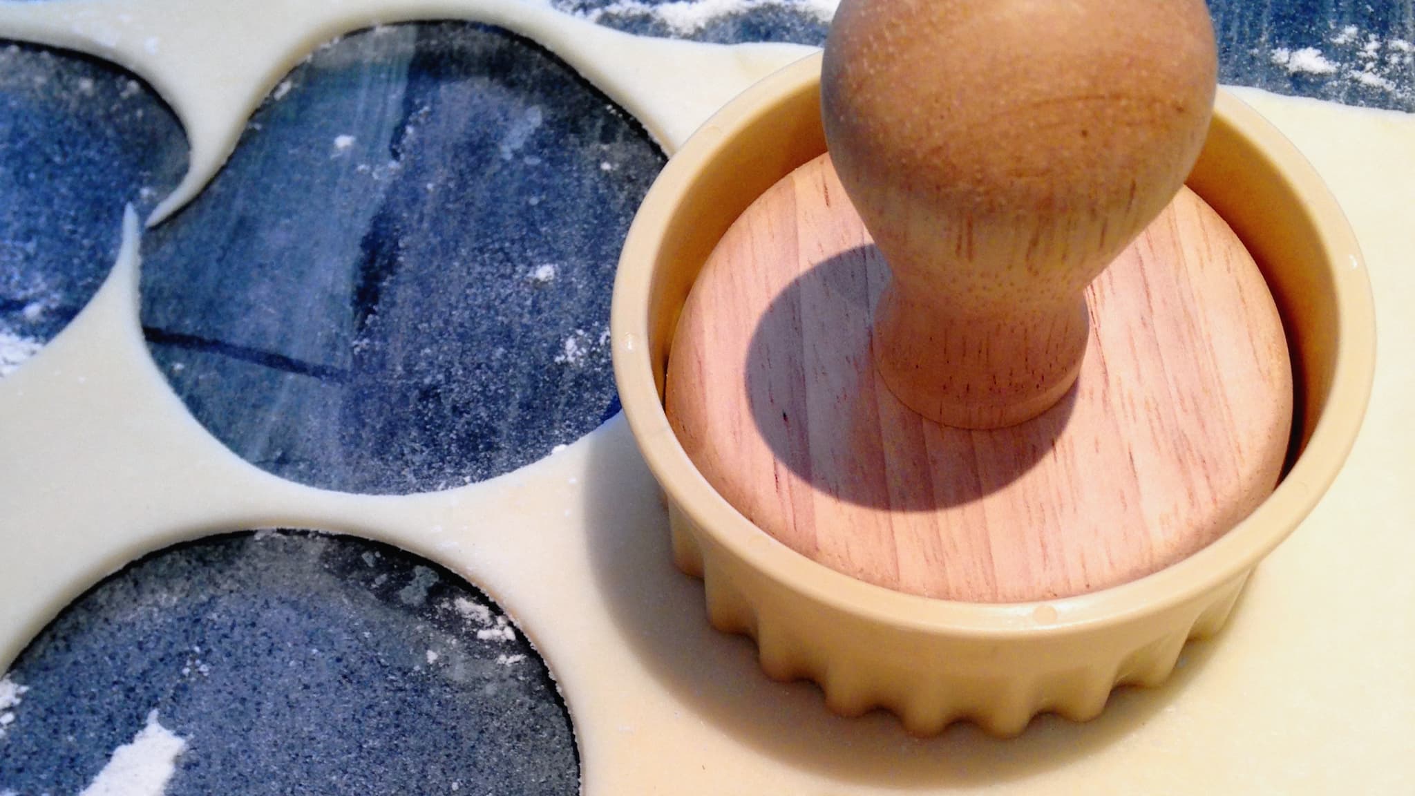 Place the biscuit stamp in the fluted cutter to imprint Herdy's face onto the mince pie lid