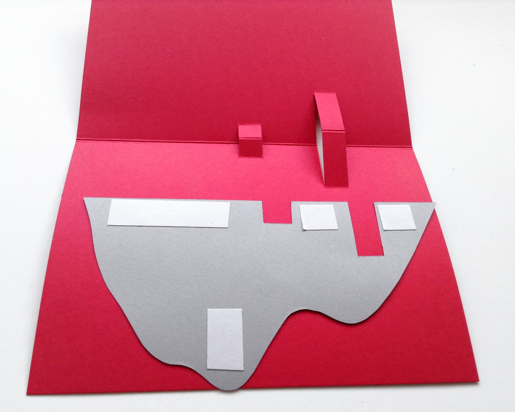 Apply double-sided sticky tape and place flat onto the Valentine's card