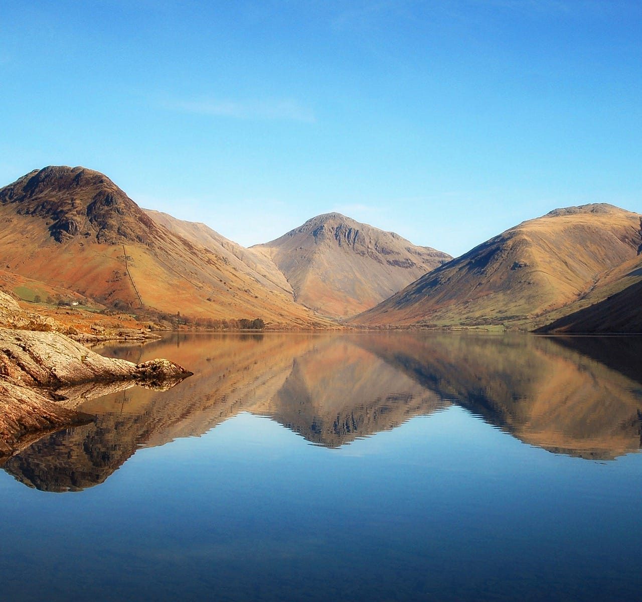 The view of the Wasdale fells from the foot of Wastwater, shot in the Spring, with perfect reflections. Fells are Yewbarrow on the left, Great Gable in the centre, and Lingmell on the right.