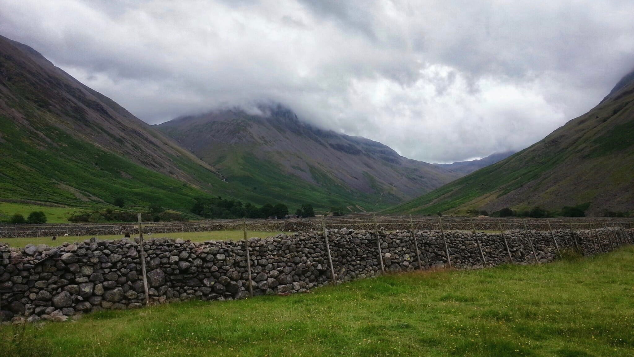 The view of Great Gable from Wasdale Head, it's summit slightly obscured by the clouds overhead.