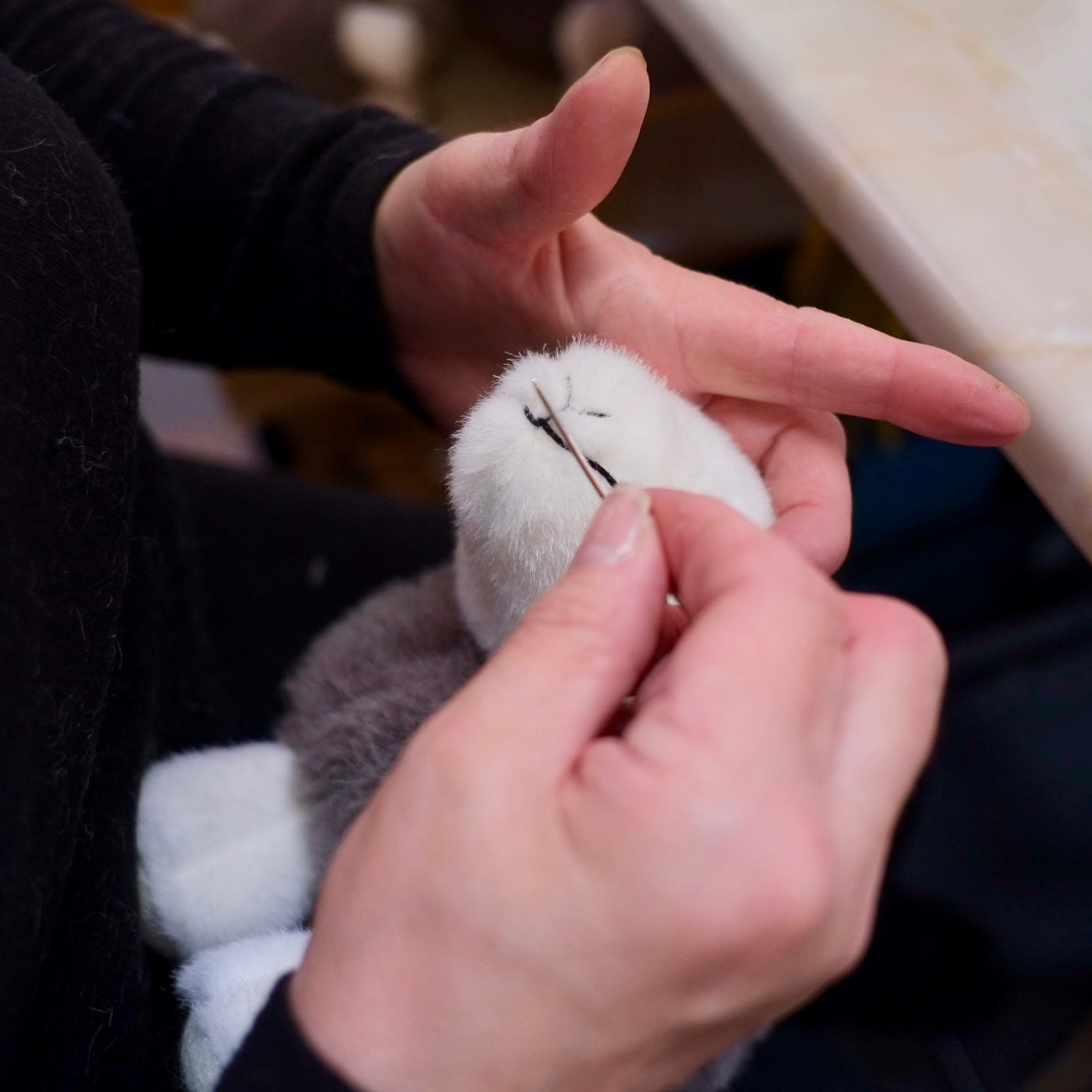 Merrythought workers putting the final touches to the face of the original My Herdy