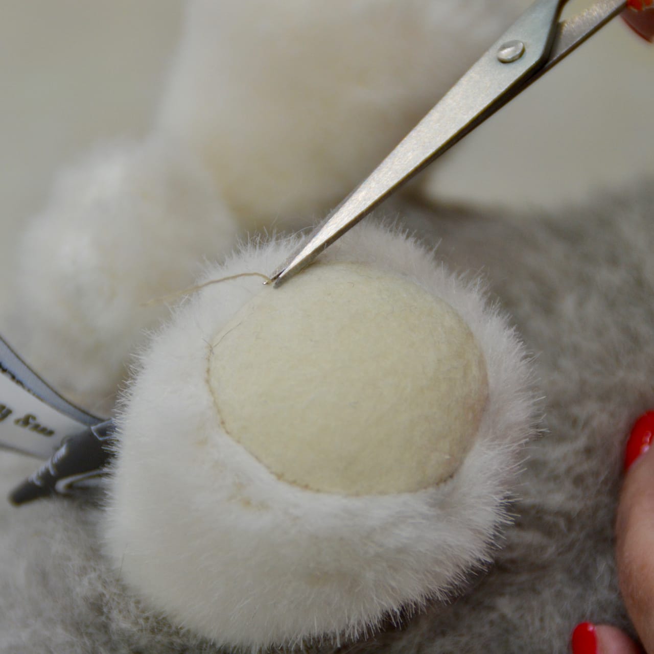 Trimming the wool felt details on the feet of My Herdy Tup