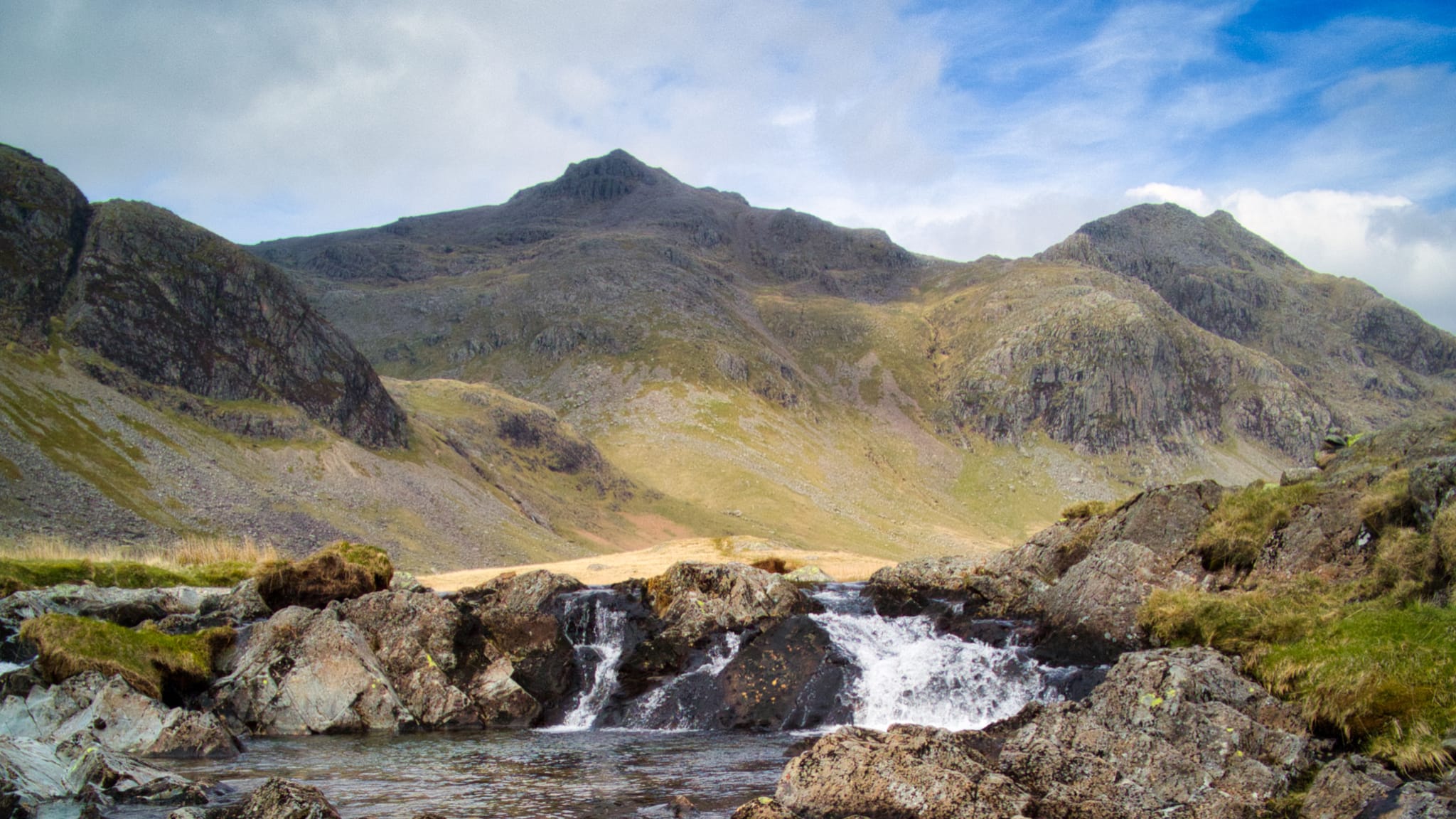 A view of Scafell Pike and its nearby fells from the Great Moss hanging valley above Eskdale