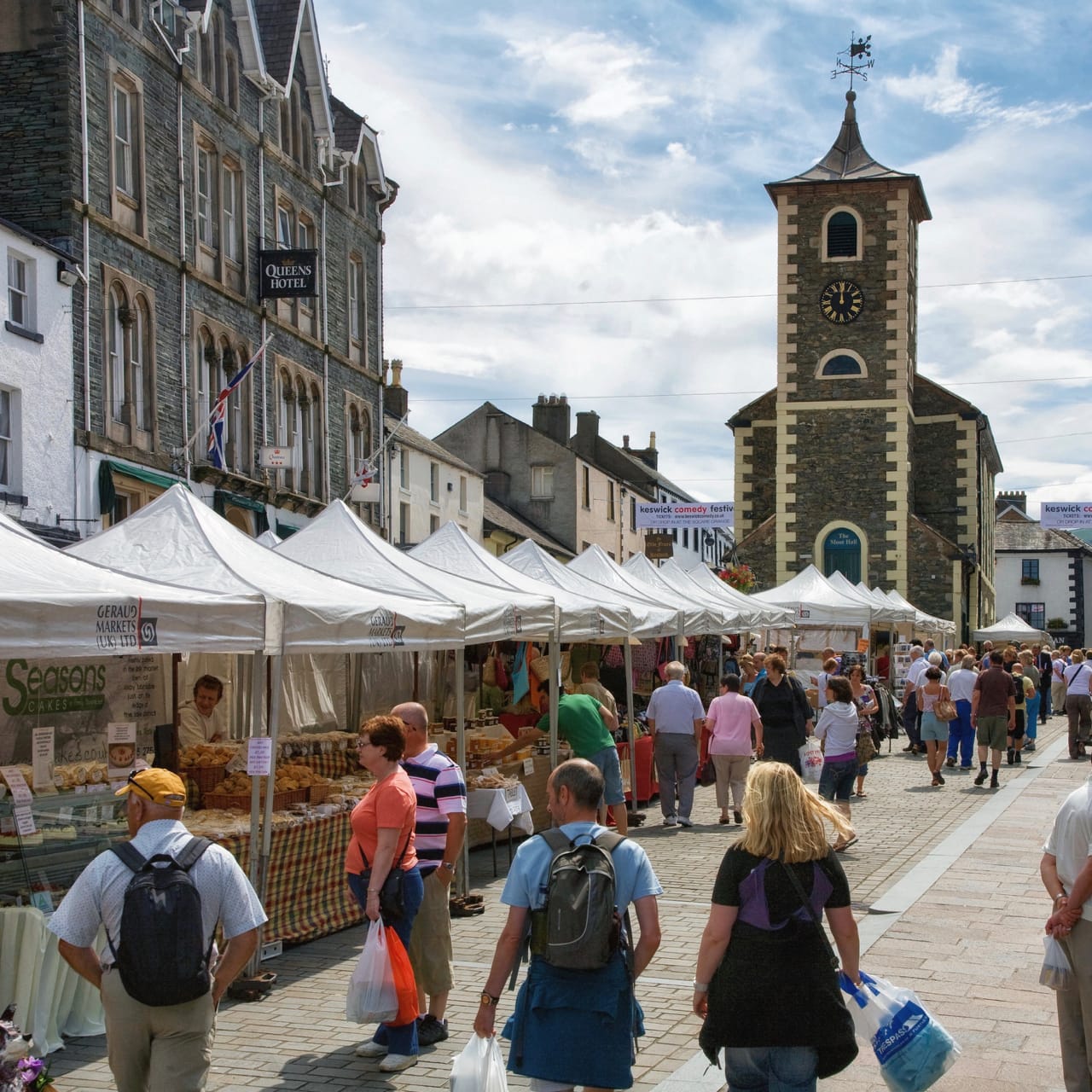 Keswick outdoor market on a sunny day, with Moot Hall at its head. Photo by DAVID ILIFF. License: CC BY-SA 3.0