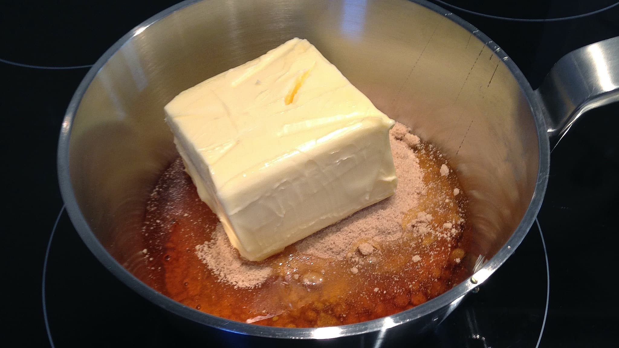 Melting "wet" ingredients together to make Christmas gingerbread