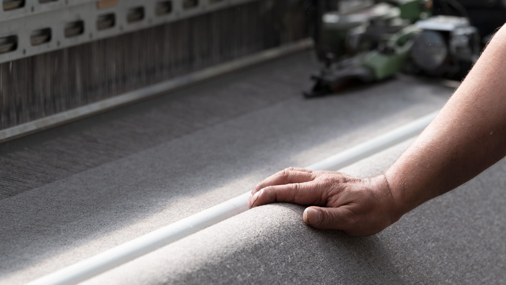 Menders inspect every inch of the fabric that comes off the loom and manually fix any snags