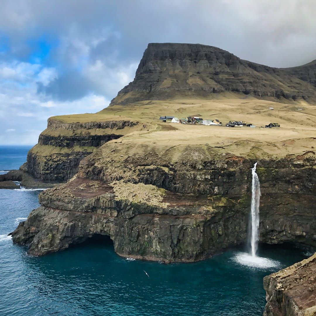 Perhaps the Faroe Islands' most famous waterfall: Múlafossur. Photo by Drega05, licensed by CC-by-SA-4.0