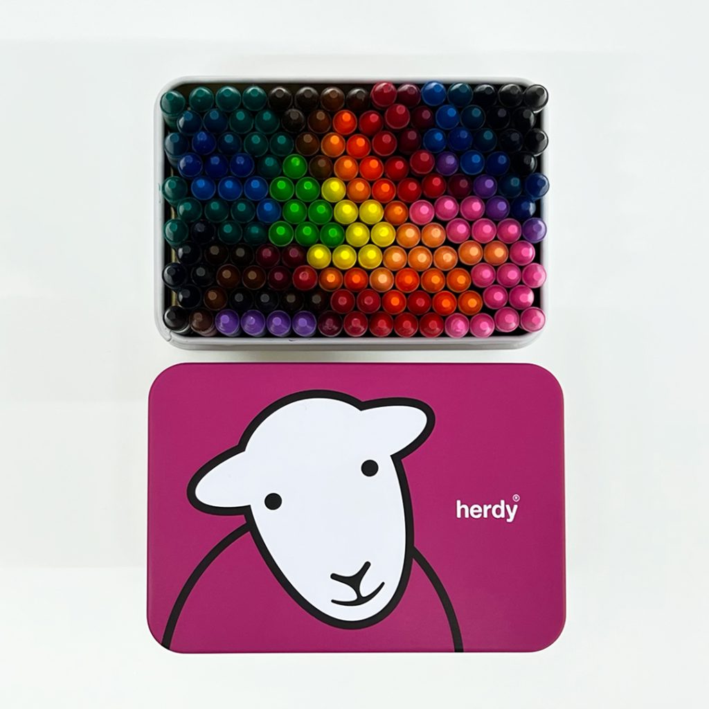 Herdy Shortbread pink tin: Tin used for keeping colouring crayons
